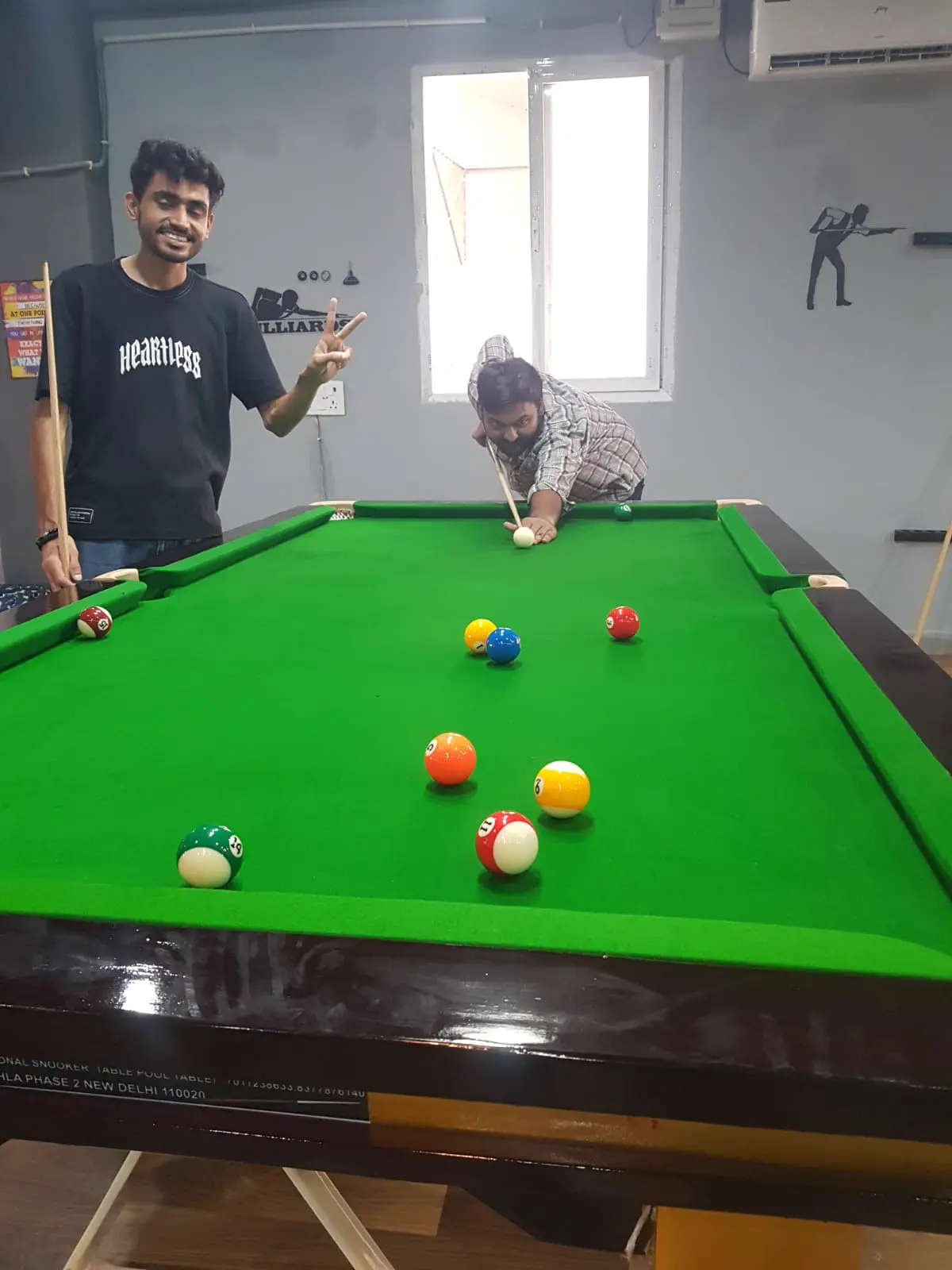 Guests playing pool at THE GAME PAVILION